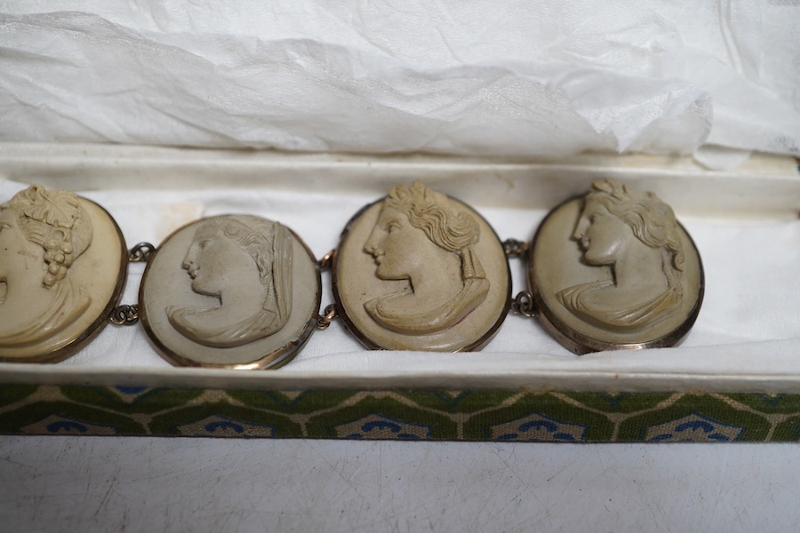 A 19th century Italian Grand Tour souvenir gilt metal lava cameo portrait bracelet, 19cm, Condition - repairs to gilt metal frames, cameos in fair condition